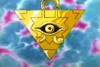 Gold inverted-pyramid, bearing the Eye of Wdjat, with a loop on the base that can be threaded through